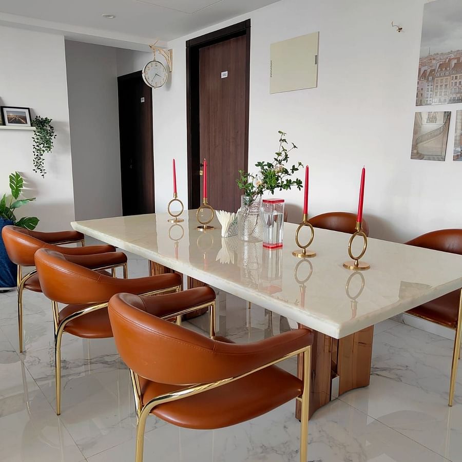 Dining Table | a modern dining table and chair set in the living room area at Maxxvalue Hotel, Chitranjan Tower, Powai